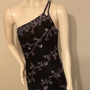 Black sequins mid length dress.  Beautiful detail size 6